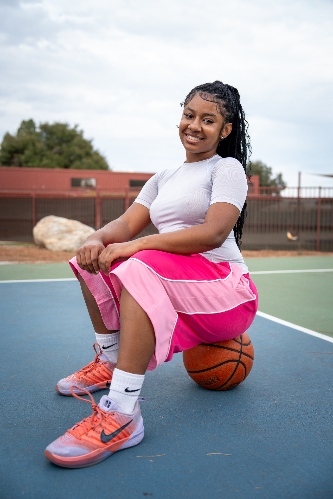 Pink shorts portrait on court